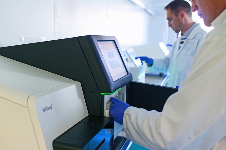 Technicians working on NGS sequencing on Illumina equipment