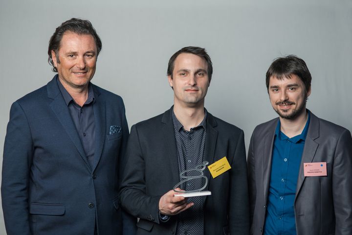 Alexandre DOUABLIN holding the trophy of the 2018 winners of the Franche Comté entrepreneurial network, surrounded by Anthony JEANBOURQUIN (CCI du Doubs) and David HERIBAN (Percipio Robotics).